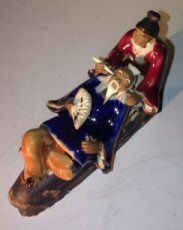 Ceramic Figurine Man & Woman Relaxing On A Bench
