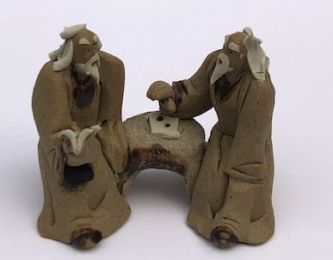 Ceramic Figurine Two Mud Men Sitting On A Bench Reading Book 2"