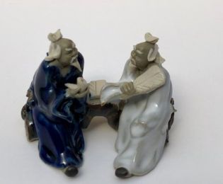 Ceramic Figurine Two Men Sitting On A Bench Holding Fan & Pipe- 2.25" Color: Blue & White